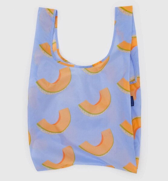 Light blue reusable BAGGU bag with allover cantaloupe slice print and blue logo tag